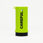 Green Careful Golf Caddy brush with 'CAREFUL'  and ‘patent pending’ text on a white background
